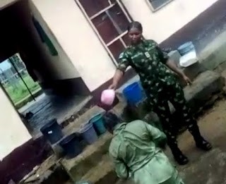 Embarassing Viral Video Clip Of Nigerian Soldier Assaulting Female member By Pouring Dirty Water On Her