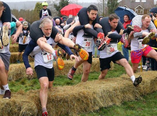 Finnish Duo Triumph At The UK Wife‑Carrying Race