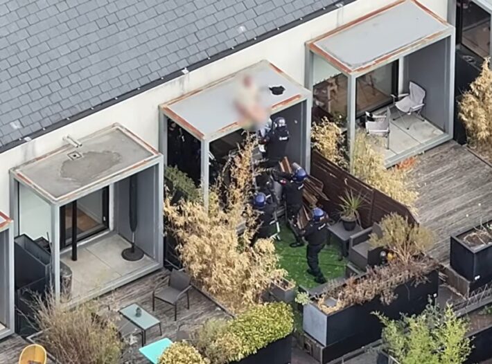 Dramatic End To 48 Hour Salford Standoff As Police Pull wanted Man from Roof Whilst He Slept
