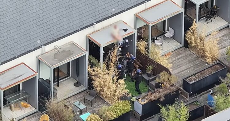 Dramatic End To 48 Hour Salford Standoff As Police Pull wanted Man from Roof Whilst He Slept